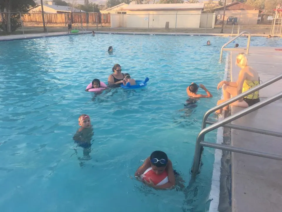 Kids swimming in the Kearny town pool — before the crisis